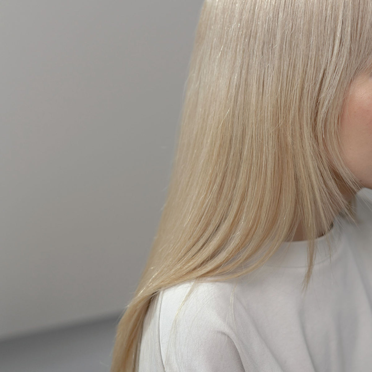 Smooth, shiny blonde hair after a professional smoothing treatment